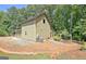 The rear of the property features charming home exterior, and a cozy porch swing at 460 Morgan Mill Rd, Brooks, GA 30205