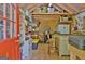 Outbuilding's tidy interior is equipped with shelving and storage solutions for tools and equipment at 460 Morgan Mill Rd, Brooks, GA 30205