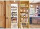 Walk-in pantry with organized shelving and lots of storage space, adjacent to the kitchen at 460 Morgan Mill Rd, Brooks, GA 30205