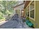 Relaxing outdoor patio with comfortable seating and view of the surrounding trees at 460 Morgan Mill Rd, Brooks, GA 30205