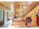 Wooden staircase with decorative iron railings leading to the upper level of the home at 460 Morgan Mill Rd, Brooks, GA 30205