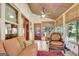 Bright sunroom with a wood ceiling, and offering an inviting spot to relax and enjoy nature views at 460 Morgan Mill Rd, Brooks, GA 30205