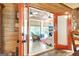 Bright sunroom with wooden walls, doors, and a comfortable seating area at 460 Morgan Mill Rd, Brooks, GA 30205