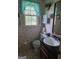 Bright bathroom with seashell wallpaper, white vanity and coordinated accessories at 529 Valley Woods Se Cir, Conyers, GA 30094