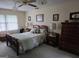 Comfortable bedroom with natural light, ceiling fan and beautiful wood accents and furniture at 529 Valley Woods Se Cir, Conyers, GA 30094