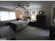 Traditional bedroom features a ceiling fan and classic dark wooden furniture at 529 Valley Woods Se Cir, Conyers, GA 30094