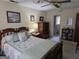 Bedroom features a wooden bed frame, with a view into an adjacent bathroom at 529 Valley Woods Se Cir, Conyers, GA 30094