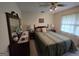Traditional bedroom with carpet, ceiling fan and natural light from the window at 529 Valley Woods Se Cir, Conyers, GA 30094