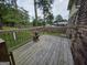 Wooden deck offering an outdoor space with railings and view of the backyard with trees at 529 Valley Woods Se Cir, Conyers, GA 30094