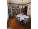 Traditional dining room with wooden table, chairs, china cabinet and retro wallpaper at 529 Valley Woods Se Cir, Conyers, GA 30094
