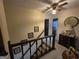 Second story hallway and staircase with carpet, painted walls and wooden railings at 529 Valley Woods Se Cir, Conyers, GA 30094