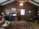Spacious living room featuring wood paneling, comfortable seating, and vintage decor with an exterior door at 529 Valley Woods Se Cir, Conyers, GA 30094