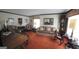 Classic living room featuring plush orange carpeting, vintage furniture, and traditional decor with a piano at 529 Valley Woods Se Cir, Conyers, GA 30094