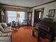Inviting living room features an organ, comfortable seating, and large windows at 529 Valley Woods Se Cir, Conyers, GA 30094