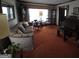 Spacious living room with plush sofa, orange carpet, and classic furnishings at 529 Valley Woods Se Cir, Conyers, GA 30094