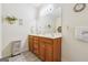 Clean, well-lit bathroom features double sinks, a large mirror, and wood cabinets at 119 Holiday Road, Unit 301 Rd # 301, Buford, GA 30518