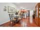 Elegant dining area with hardwood floors and decorative lighting, adjacent to the kitchen at 119 Holiday Road, Unit 301 Rd # 301, Buford, GA 30518
