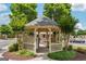 Community gazebo and mail center with covered area and mature landscaping at 119 Holiday Road, Unit 301 Rd # 301, Buford, GA 30518