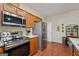 Efficient kitchen showcases wood cabinets and stainless steel appliances at 119 Holiday Road, Unit 301 Rd # 301, Buford, GA 30518
