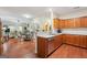 Bright open kitchen with wood cabinets, stainless appliances, and dining area at 119 Holiday Road, Unit 301 Rd # 301, Buford, GA 30518