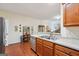 Well-lit kitchen features wood cabinets, stainless dishwasher, and open access at 119 Holiday Road, Unit 301 Rd # 301, Buford, GA 30518