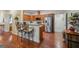 Modern kitchen with stainless steel appliances, breakfast bar, and hardwood flooring at 119 Holiday Road, Unit 301 Rd # 301, Buford, GA 30518