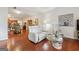 Spacious living room with hardwood floors flowing into an adjacent dining area and kitchen at 119 Holiday Road, Unit 301 Rd # 301, Buford, GA 30518