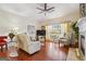 Comfortable living room featuring hardwood floors, a large window, and stylish decor at 119 Holiday Road, Unit 301 Rd # 301, Buford, GA 30518