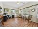 Sunroom featuring hardwood floors, large windows, and comfortable furniture for a cozy living space at 119 Holiday Road, Unit 301 Rd # 301, Buford, GA 30518