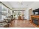Versatile sunroom with wood floors, many windows, and a fireplace for added warmth and ambiance at 119 Holiday Road, Unit 301 Rd # 301, Buford, GA 30518