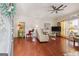 Bright and airy living room with hardwood floors and a decorative ceiling fan at 119 Holiday Road, Unit 301 Rd # 301, Buford, GA 30518
