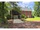 Large brick home with attached garage and landscaped backyard at 172 Sam Solomon Rd, Locust Grove, GA 30248