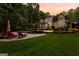 Stunning backyard featuring a pool, spa, patio, and lush landscaping for ultimate outdoor enjoyment at 307 Bellingrath Ct, Peachtree City, GA 30269