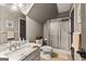 Upstairs bathroom with tiled walk-in shower, vanity with sink, and tiled flooring at 307 Bellingrath Ct, Peachtree City, GA 30269