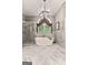 Elegant bathroom showcasing a soaking tub, glass shower, and marble flooring and walls at 307 Bellingrath Ct, Peachtree City, GA 30269