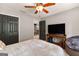 This bedroom features a ceiling fan and dark closet doors adding a touch of sophistication to the space at 307 Bellingrath Ct, Peachtree City, GA 30269