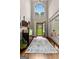 Grand foyer with high ceilings, a decorative rug, and a view to the yard at 307 Bellingrath Ct, Peachtree City, GA 30269
