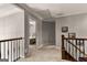 Second-floor hallway with carpet leads to a cozy bedroom at 307 Bellingrath Ct, Peachtree City, GA 30269