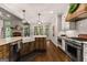 Beautiful kitchen featuring wood island, stainless steel appliances, and view to outdoor living at 307 Bellingrath Ct, Peachtree City, GA 30269