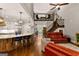 Bright, open-concept living space flows into a kitchen and features hardwood floors and staircase at 307 Bellingrath Ct, Peachtree City, GA 30269