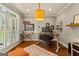 Comfortable office with white plantation shutters, light gray walls, and hardwood floors at 307 Bellingrath Ct, Peachtree City, GA 30269
