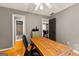 The office includes hardwood floors, and is steps away from a bathroom and stairway at 307 Bellingrath Ct, Peachtree City, GA 30269