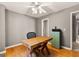 This office space features hardwood floors and a large window offering lots of natural light at 307 Bellingrath Ct, Peachtree City, GA 30269