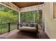 Relaxing screened porch featuring a swing, wood ceiling and views of the outdoors at 307 Bellingrath Ct, Peachtree City, GA 30269