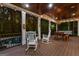 Beautiful screened porch with wood ceiling, string lights, and furniture creating an inviting outdoor space at 307 Bellingrath Ct, Peachtree City, GA 30269