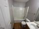 Clean bathroom with a shower-tub combo, toilet, and vanity, offering functionality and potential for customization at 2355 Burdett Ridge Dr, South Fulton, GA 30349