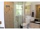 Bathroom featuring a tiled shower with glass doors and a neutral color palette at 1310 Larkview Sw Dr, Lilburn, GA 30047