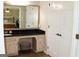 View from the bathroom into the bedroom with a large mirror reflecting the bedroom interior at 1310 Larkview Sw Dr, Lilburn, GA 30047