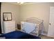 Bedroom bedroom with a crib, dresser, and carpeted floors at 1310 Larkview Sw Dr, Lilburn, GA 30047