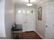 Welcoming foyer with elegant double doors, hardwood floors, light fixture, and stylish decor that create a warm entrance at 1310 Larkview Sw Dr, Lilburn, GA 30047